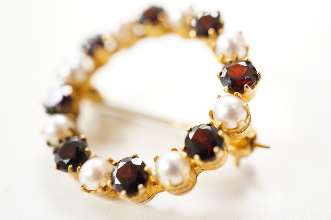 A Victorian 15ct and diamond set navette shaped Etruscan style brooch (lacking pin), 46mm, gross weight 3.5 grams, a 9ct, amethyst and seed pearl set bar brooch and a 9ct, garnet and split pearl set wreath brooch, gross